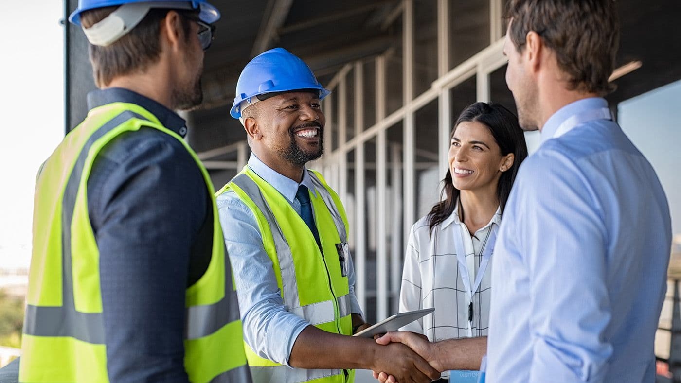 construction workers shaking hands