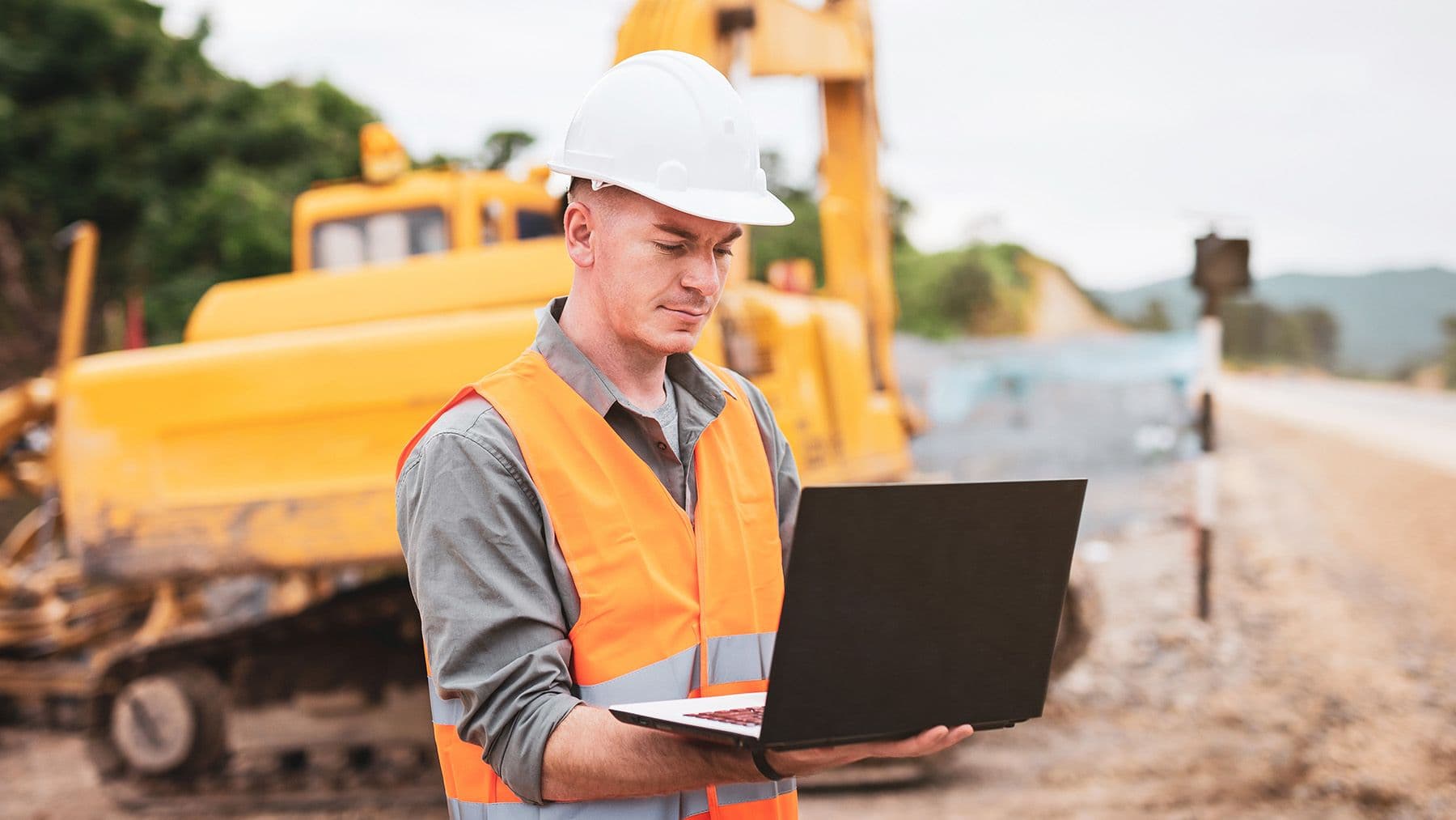 Construction worker on laptop