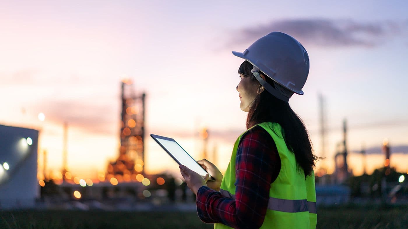 person using an iPad on a construction site